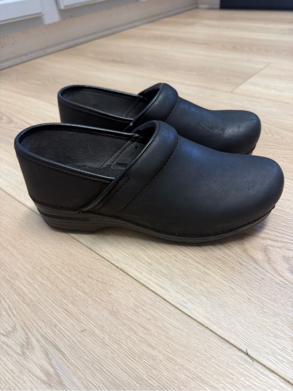 Dansko Black Leather Slip-On Clogs